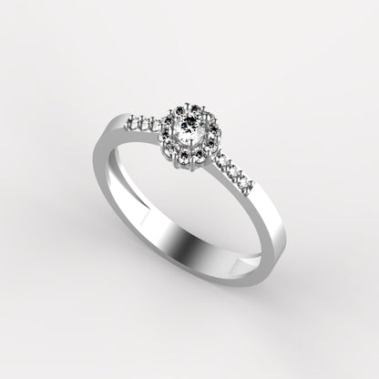 Anillo solitario en oro amarillo 18K con diamante natural de 0,10ct en halo redondo con 16 brillantes y pavé en banda – Joyería Lucigo Colombia