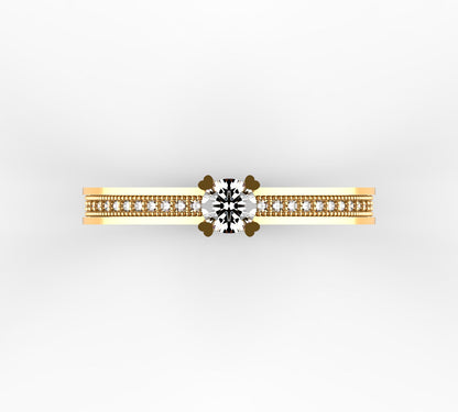 Anillo solitario en oro amarillo 18K con diamante natural de 0,23ct en garras rematadas en corazón y banda ancha milgrain con 28 brillantes en micropavé completo – Joyería Lucigo Colombia